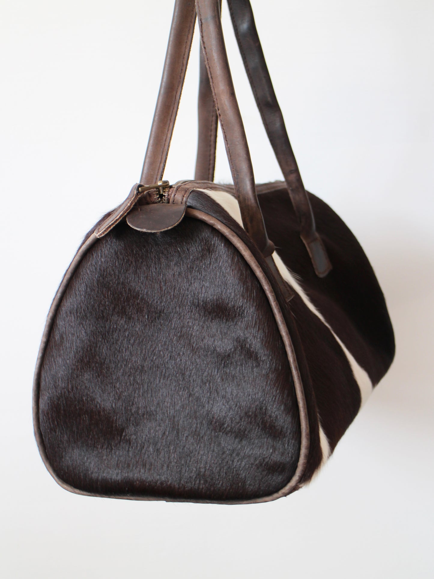 COWHIDE BARREL BAG
